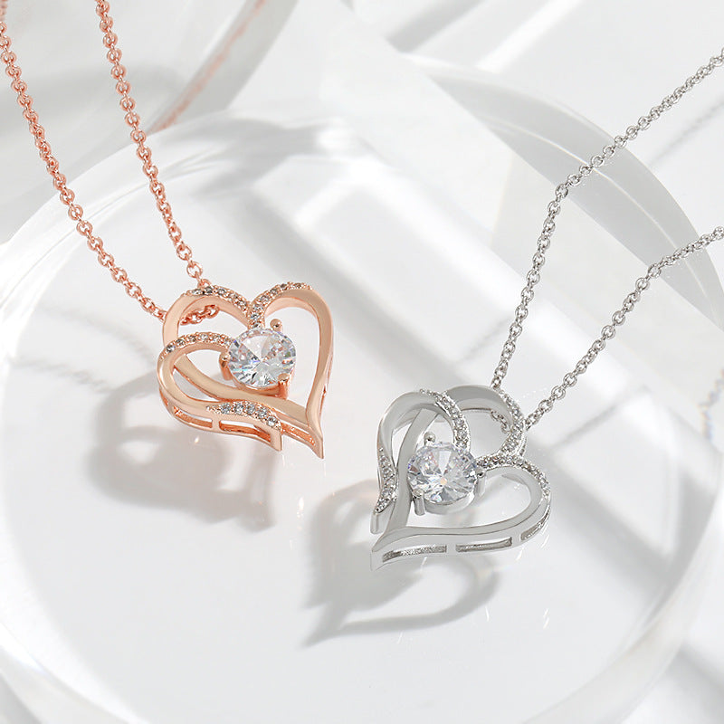 Perlevida double heart pendant necklace in Rose Gold with sparkling rhinestone accents