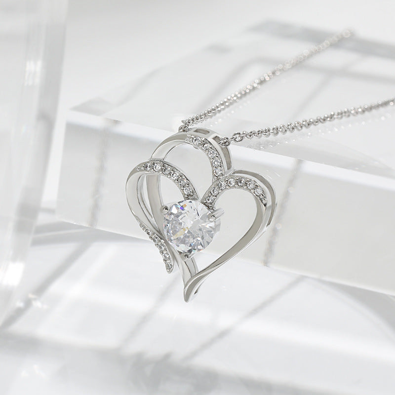Perlevida double heart necklace showing the delicate chain and detailed pendant design