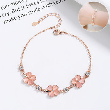 Perlevida flower charm bracelet for women in rose gold with pink stone details