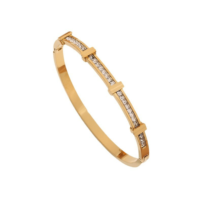 Gold-tone Perlevida open rhinestone bangle bracelet